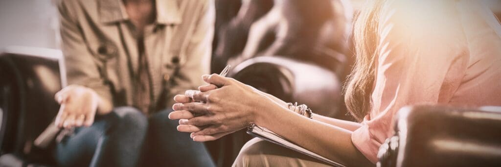 A woman speaking to a mental health proffessional during rehab in Marietta, GA.