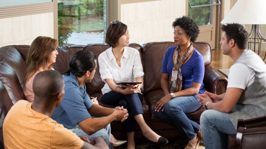 A group of people discussing about recovery resources for addiction in Johnson City.