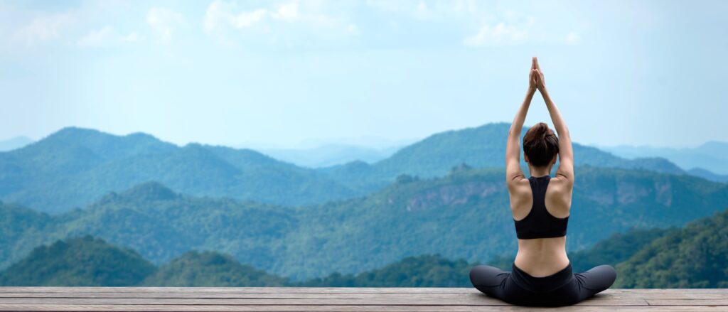 A woman practices meditation & yoga during holistic addiction treatment in Murfreesboro, TN.