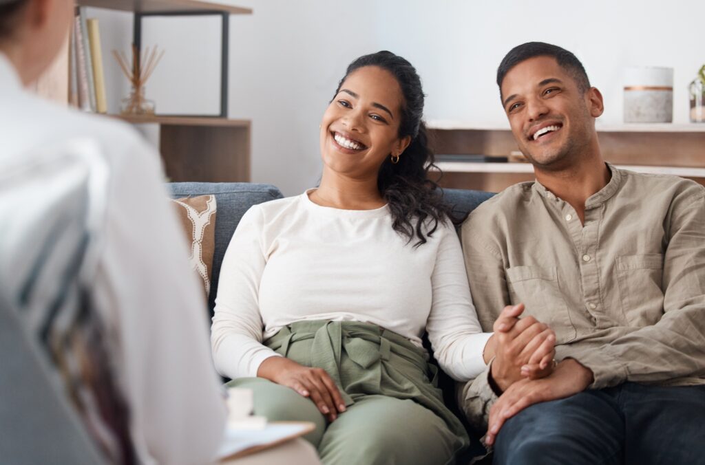 A couple seeks tennessee addiction treatment resources while speaking to a health professional.