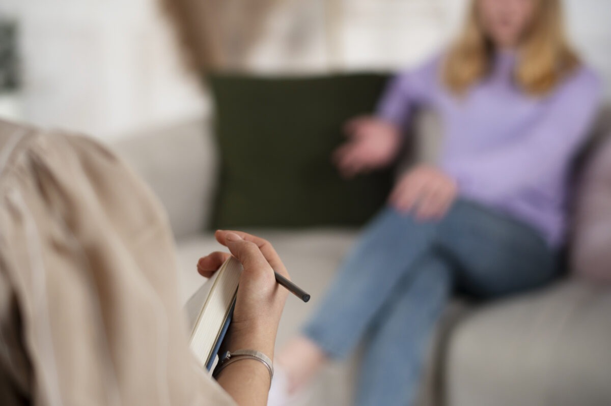 Client speaking with a therapist during addiction treatment