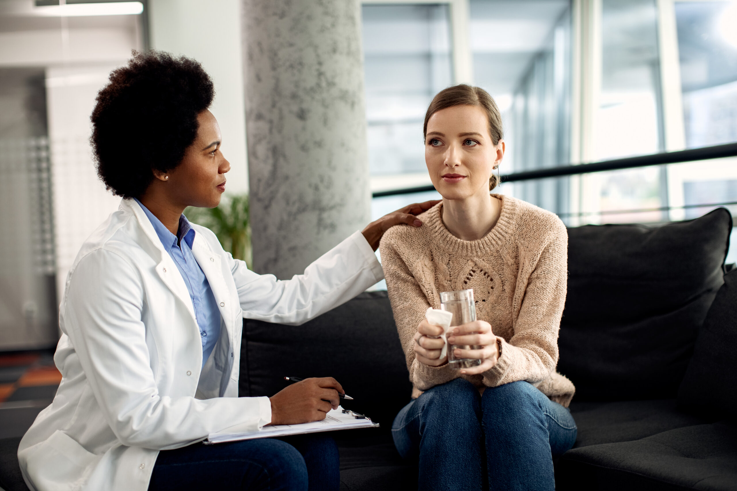 Therapist providing compassionate support during an OCD treatment session
