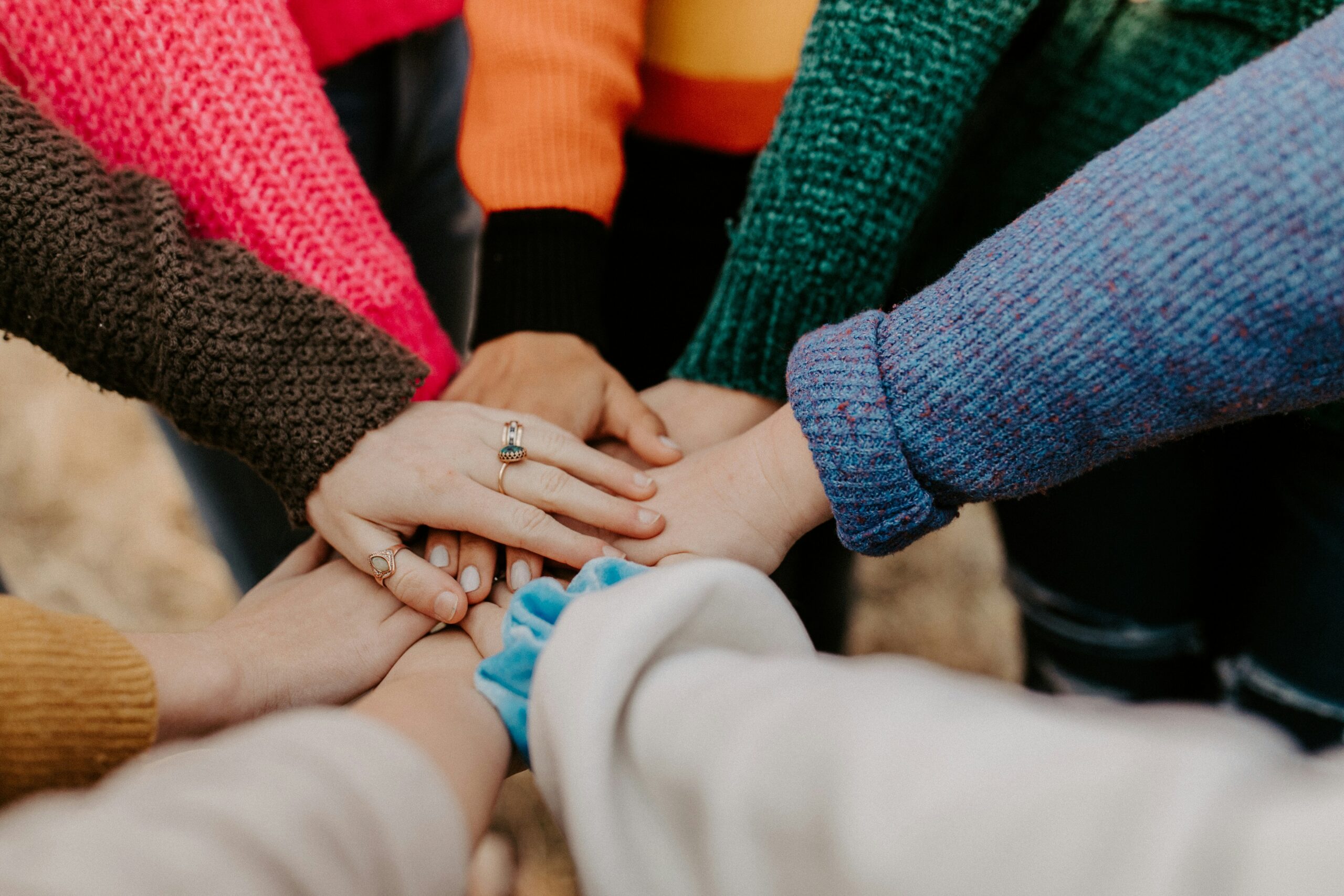 People encouraging one another through connection and peer support in addiction recovery
