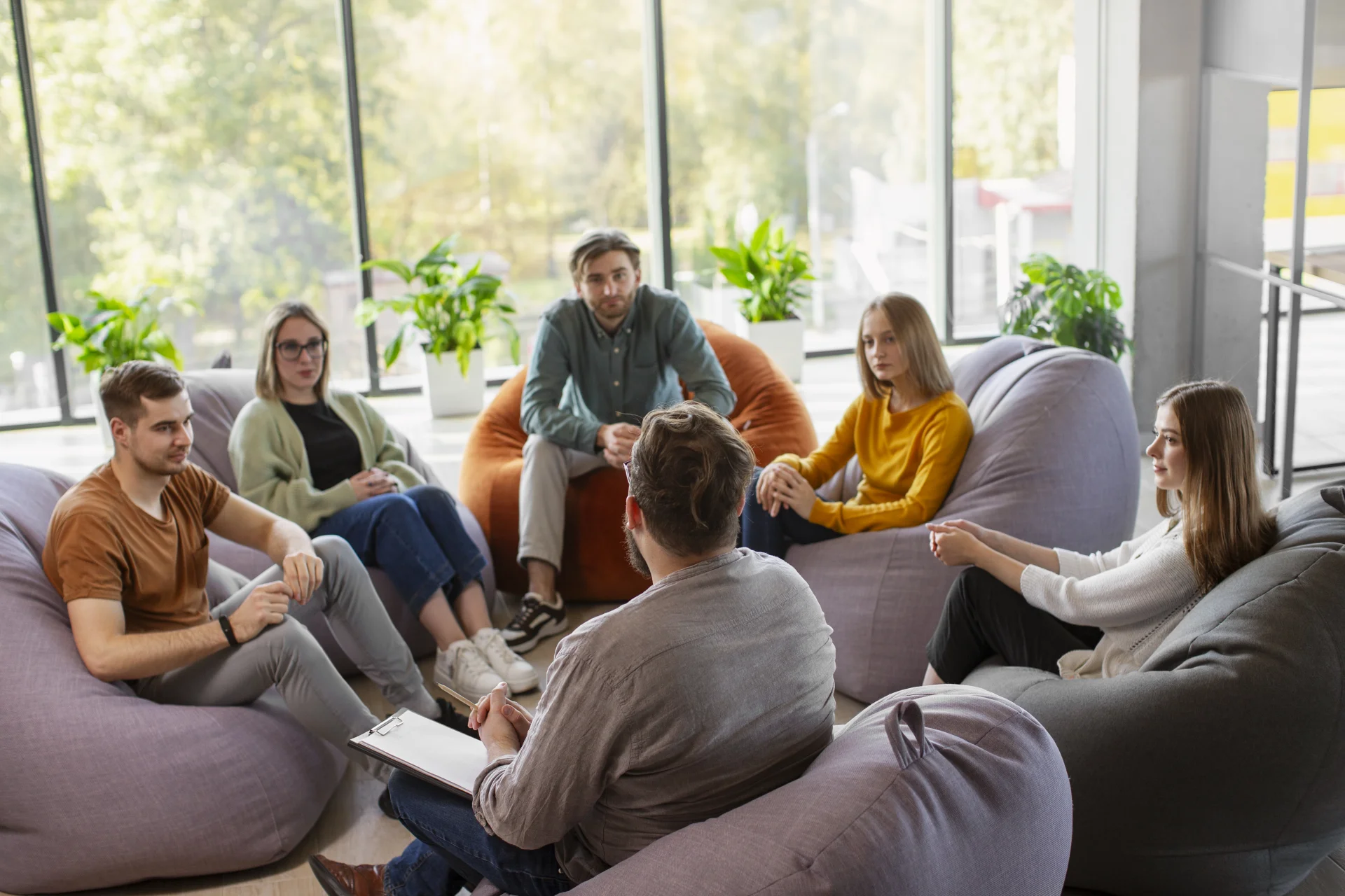 People participating in a supportive addiction therapy meeting